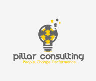 consulting logo with puzzle pieces in a light bulb 
